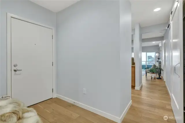 Looking toward the main entrance from hallway. There's a separate entrance to the secondary bedroom.