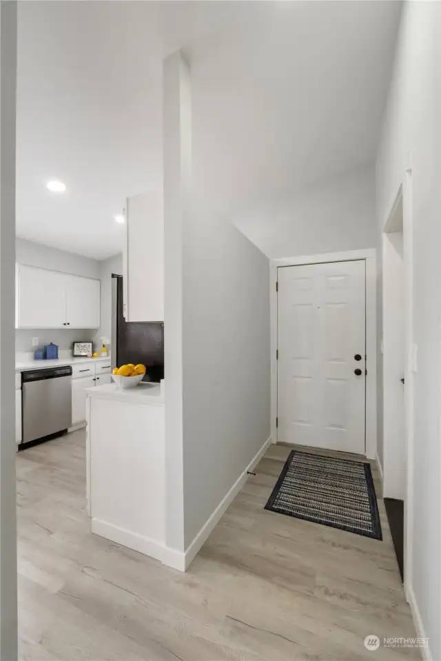 Entry hall to the front door and to the garage, on right.