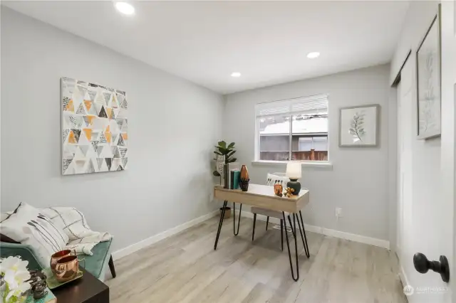 1st Bedroom with full closet.  New lighting, blinds, paneled doors, trim, flooring, & paint!