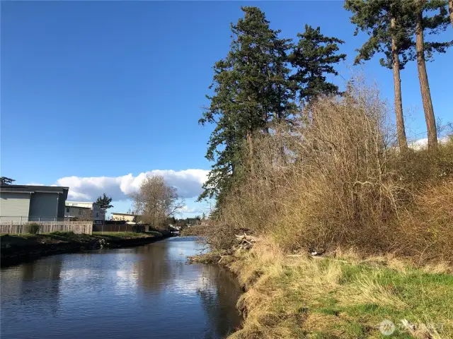 Spectacular western views with sunsets, Terrell Creek bordering property, central location to public beaches, Birch Bay State Park, boating, plus water activities including kayaking with creek to bay access.
