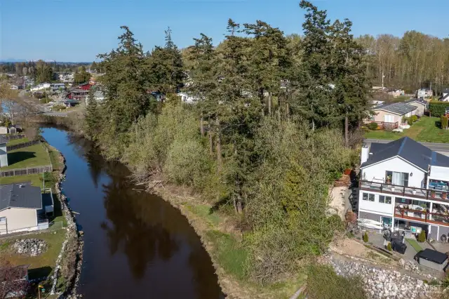 Spectacular western views with sunsets, Terrell Creek bordering property, central location to public beaches, Birch Bay State Park, boating, plus water activities including kayaking with creek to bay access.