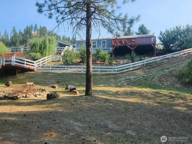 Fun backyard with fire pit.