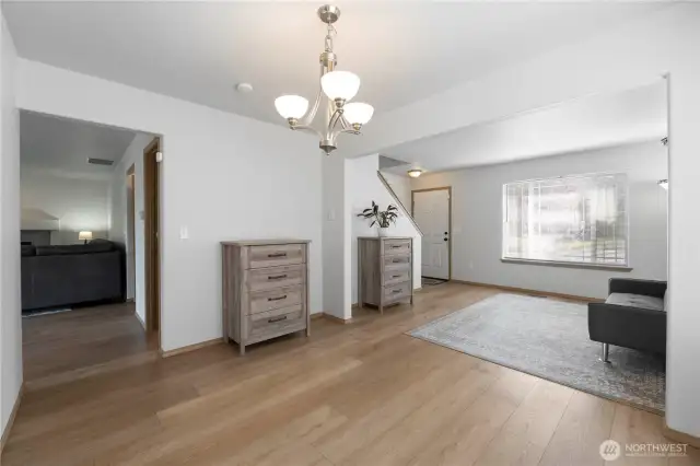 Looking from the dining room to the living room and out the front window.