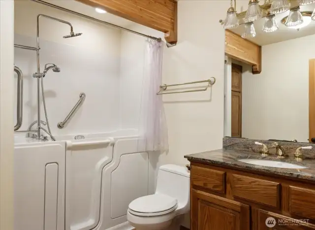 Downstair bathroom with Safe Step walk in tub and shower combo.
