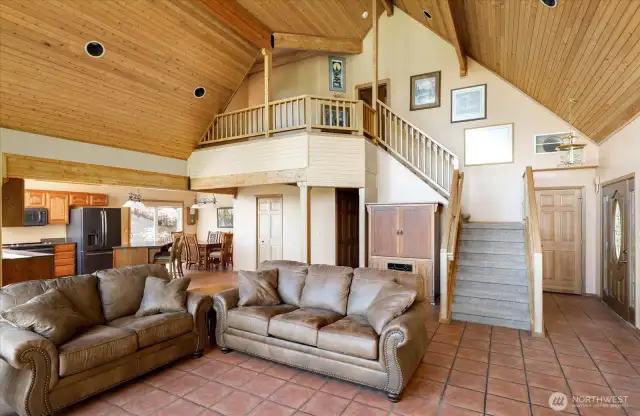 Let's go back into living room and head upstairs. See balcony office space at top of stairs?