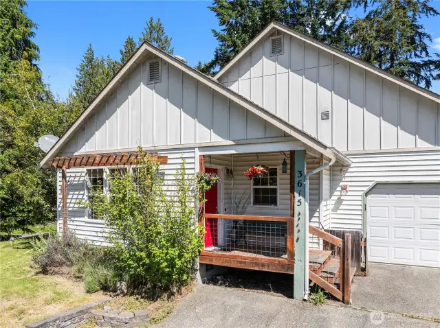 Front house trellis and see-thru guard rails on the porch are charming and relaxing.