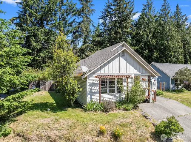 This angle shows the side yard of house on 8300 sf lot.