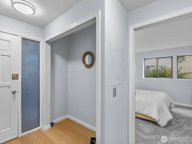 Back down the hallway to entrance closet and primary bedroom to right.