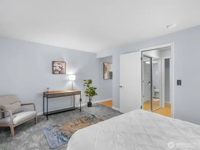 Hallway by desk takes you to walk in closet and additional space