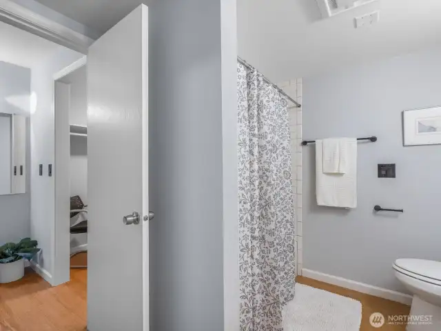 Closet along hallway from bathroom