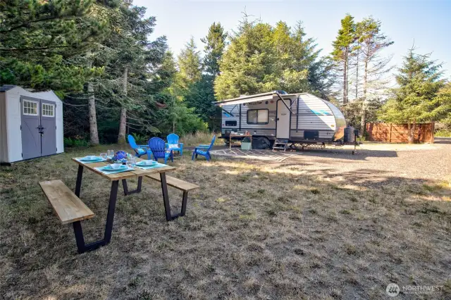 All the work is done! This cleared lot offers full utility hookups and a solid gravel drive. Surrounded by trees and a privacy fence, it's the perfect blend of seclusion and convenience.
