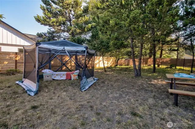 Everything you need in one spot: privacy fence, mature tree cover, full utility hookups, and a sturdy gravel pad. Enjoy peaceful mornings and cozy evenings in your own space.