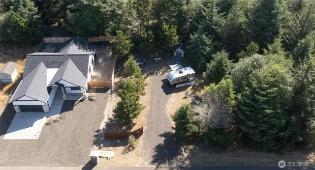 Bring your RV to this cleared, gravel-packed site with full hookups. Surrounded by natural beauty and fenced for privacy, it’s a slice of comfort in the wild.