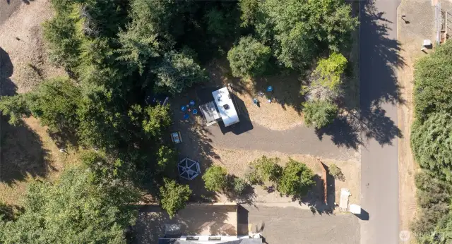 This inviting space is cleared and level, with trees on three sides and a fence to ensure seclusion. Includes full hookups and an easy-access gravel drive.