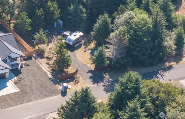Whether you’re staying for a weekend or the season, 120 days a year, this cleared lot offers water, power, and sewer, plus a privacy fence and trees for a secluded feel.