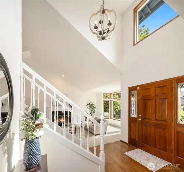 Sunlit entry with vaulted ceilings