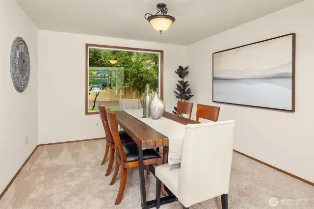 Large picture window overlooks the rear yard