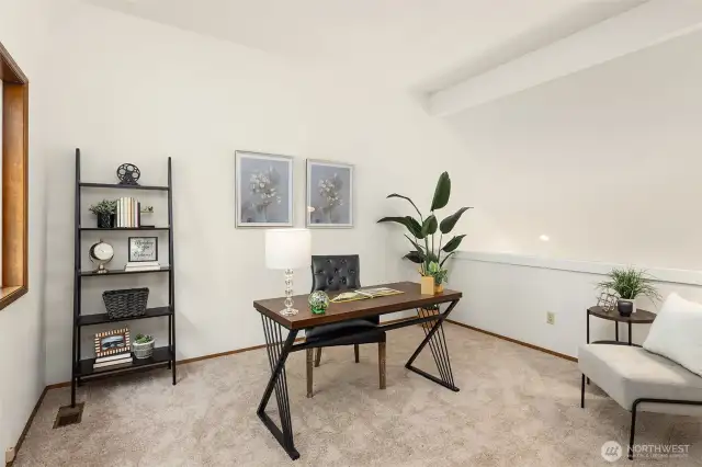 Home office or loft space conveniently located off the primary bedroom