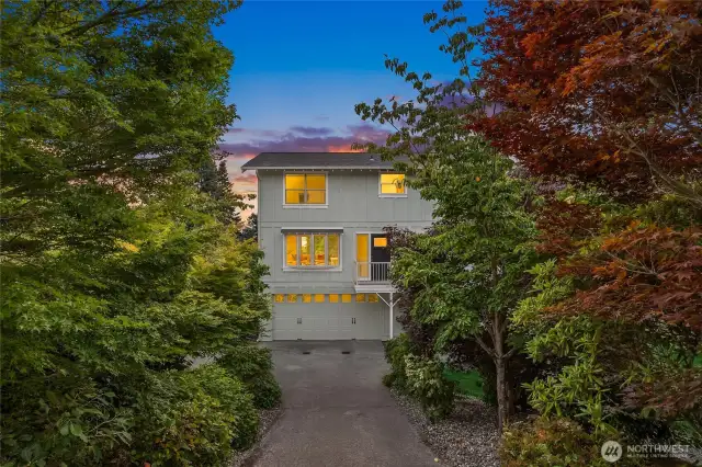 As you come down the driveway, the mature trees and shrubs, frame your entry.