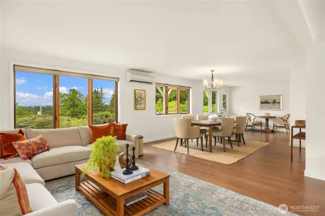 Spacious dining area centered between the living and kitchen nook. Notice the ductless heat pump which provides AC and heat!