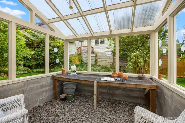 Sunny and sturdy brick greenhouse is a good place to start your veggies or nurse you annual flowers over the winter.