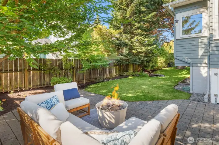 Shaded patio for entertaining, relaxation and view of pond with waterfall.