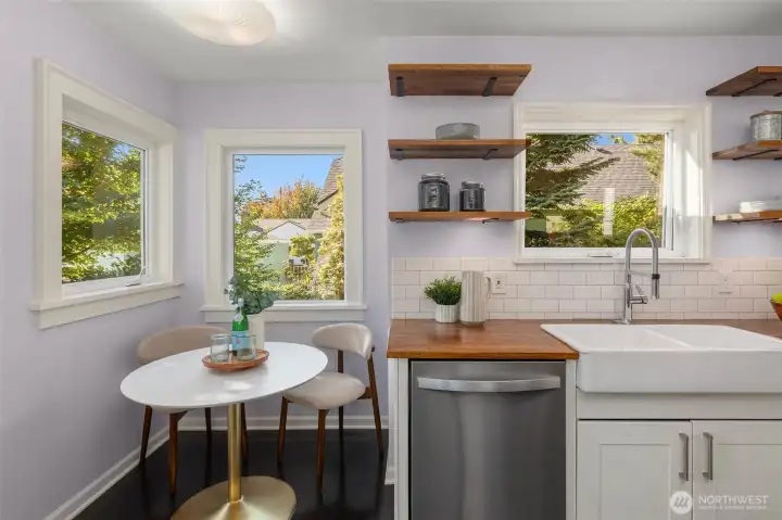 Sunny eat-in nook framed by corner south and west facing windows.