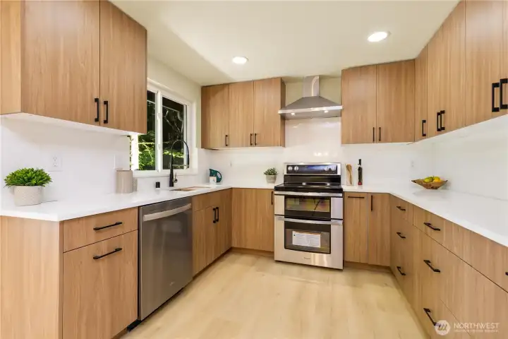 Wow! This kitchen is a stunner. New custom cabinetry, quartz countertops, and full height quartz backsplash throughout. Special drawers for garbage and spices. All new appliances.