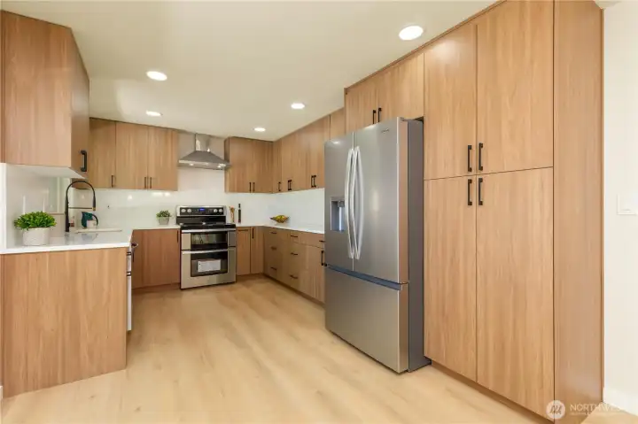 The kitchen has plenty of storage and pantry space.