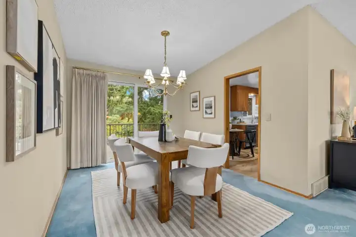 Formal dining room with easy access to the kitchen and your back patio, complete with trex deck overlooking your large lot