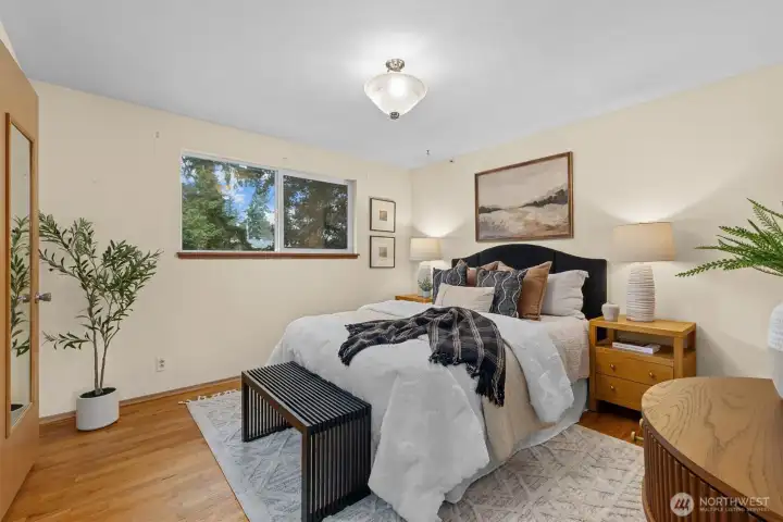Welcome to your primary bedroom with hardwood floors, ample closet space and .75 bath