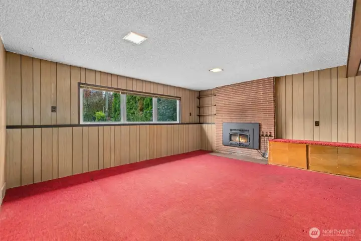 Large open space complete with fireplace insert