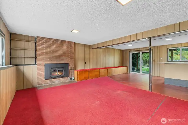 Open space near the bar would be perfect for additional seating, easy access to the back patio and your private, fully fenced back yard