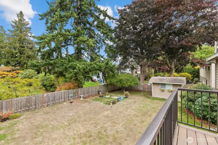 Enjoy your fully fenced back yard, complete with separate gardening area and storage shed