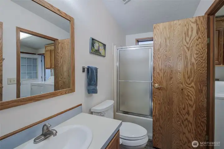 Laundry room also adjoins full bath.