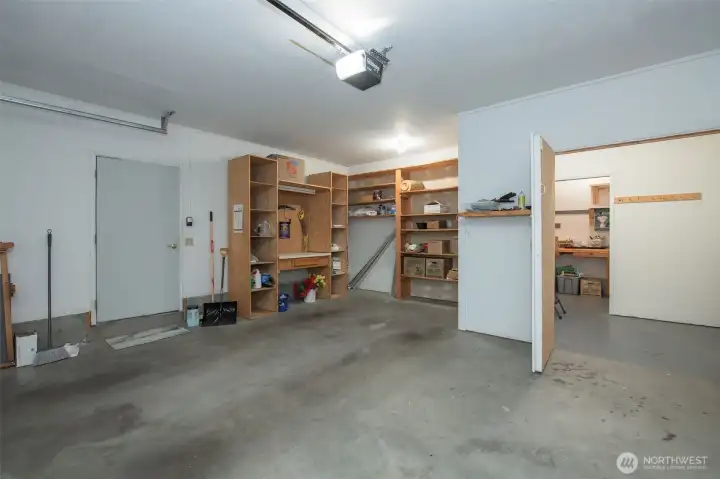 Deep garage with shelving.