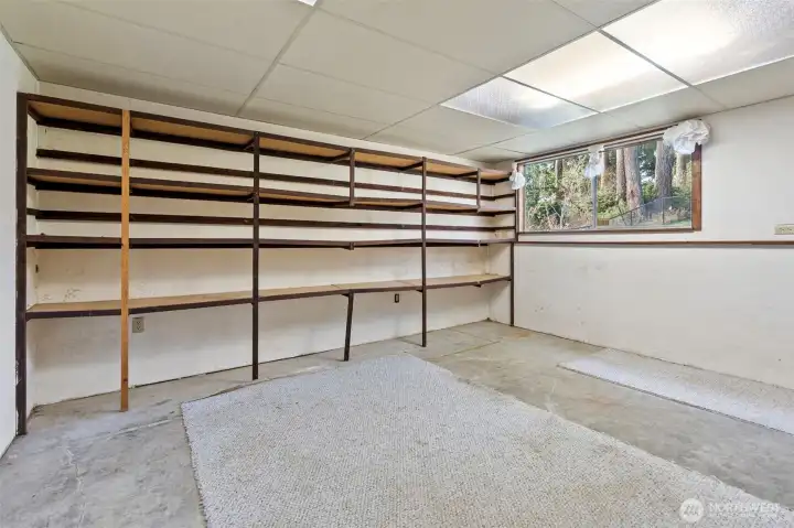 Large storage room with with tons of potential. Freezer in this room conveys!