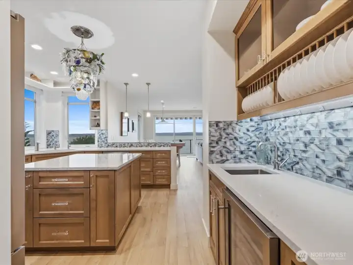 Stunning custom cabinetry. Beverage chiller & wet bar.