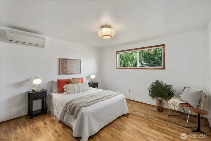 Primary Bedroom with wood floors