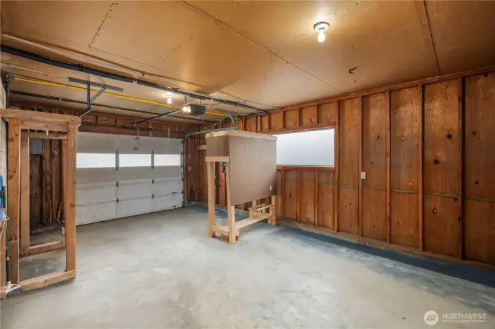 400 sqft garage, shelving, with indoor access and access to the backyard.