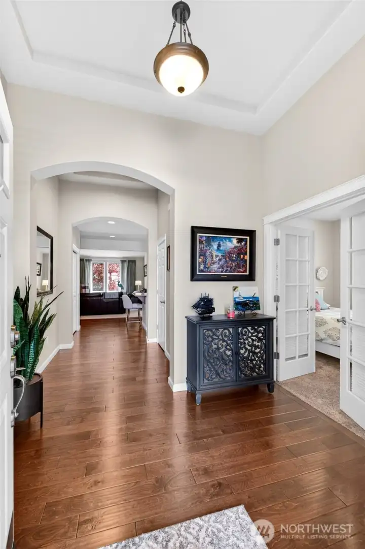 Beautiful flooring throughout the hall that leads to the kitchen/dining area.