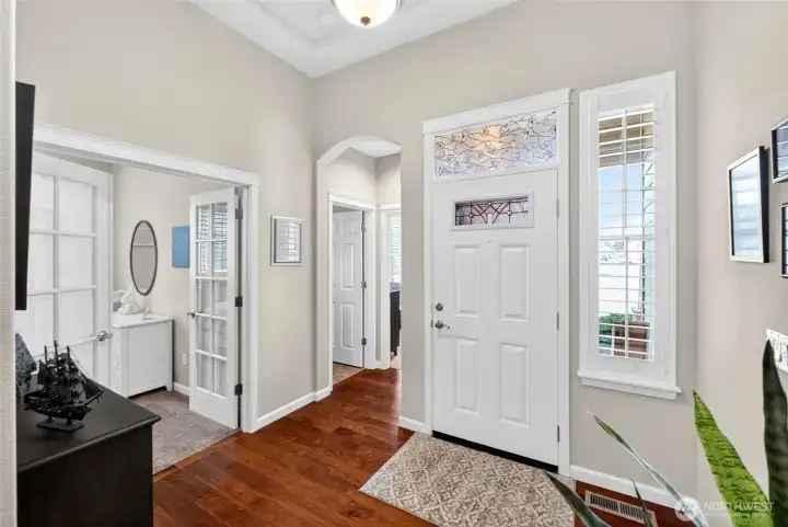 View of the front door and the two guest bedrooms plus guest bath.