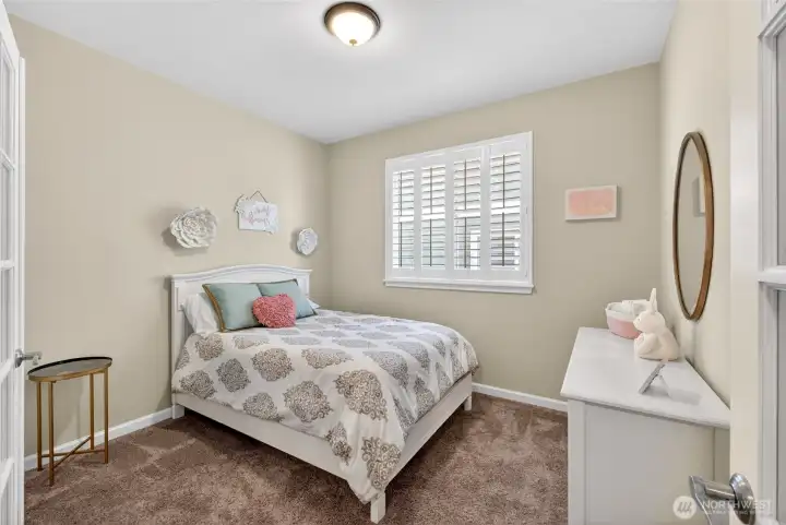 Guest Bedroom with french doors. Closet in the corner, not shown here. Use as an office or bonus space, if you choose.