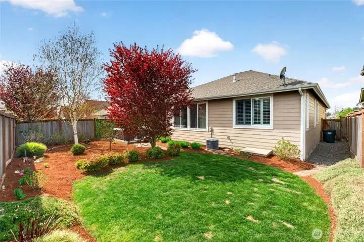 Side yard on both sides with gate on the right.