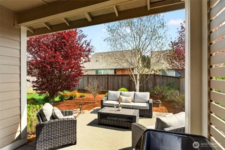 Rain or shine, you have a covered space on the patio, complete with a privacy screen.