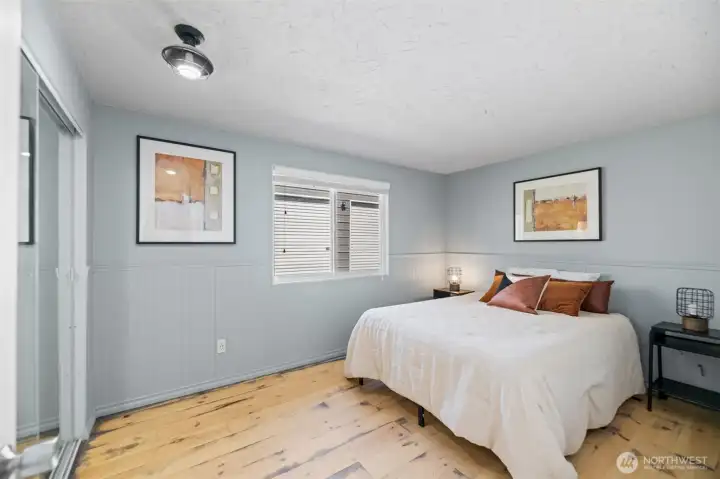 Primary bedroom located at the back of the home
