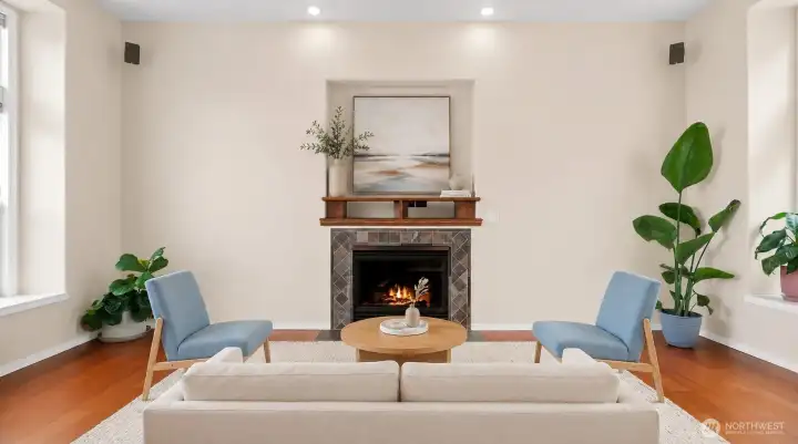 Virtual Stage: Gas fireplace sitting area with tile surround, hardwood floors, and bright natural light.