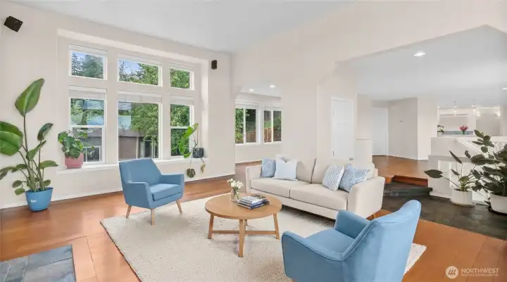 Virtual Stage: Gas fireplace sitting area with tile surround, hardwood floors, and bright natural light.