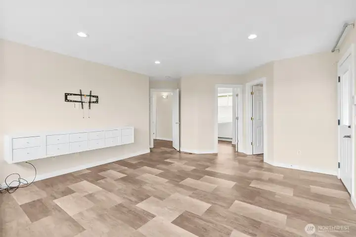 Primary bedroom with large windows, mountain views, and built-in wall storage for a clean, open feel.
