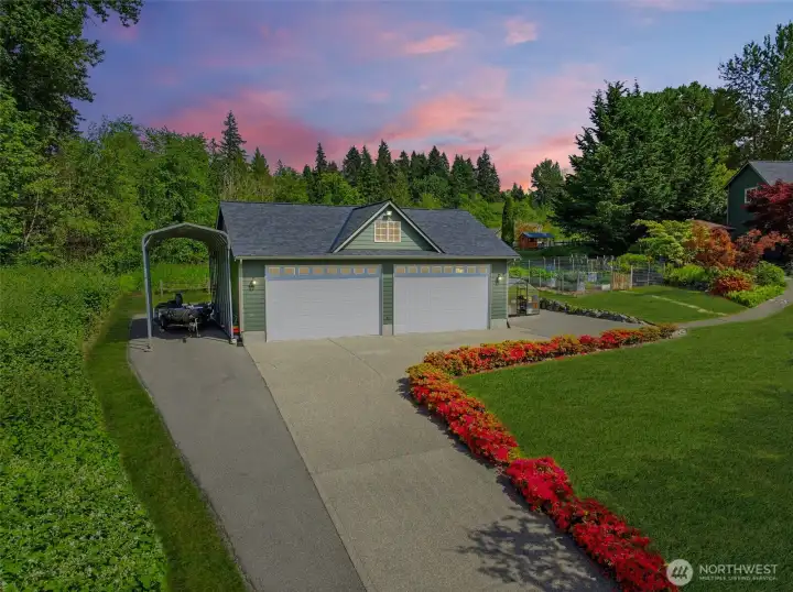 A wide driveway leads to the impressive 40X30 shop and extensive parking areas with more than enough room for RVs, boats, trailers, and recreational toys